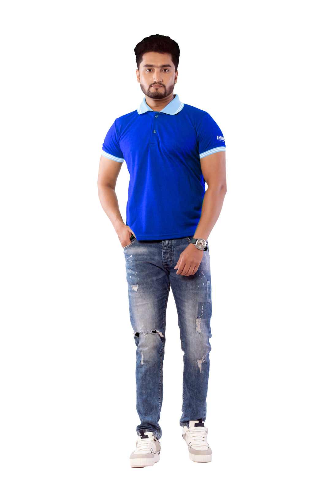 Man wearing a blue polo shirt and jeans on a white background