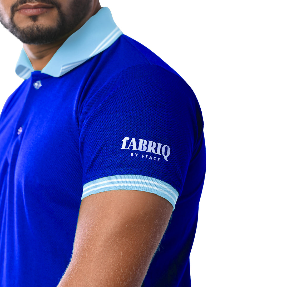 Blue polo shirt with 'fabriq' branding on a white background
